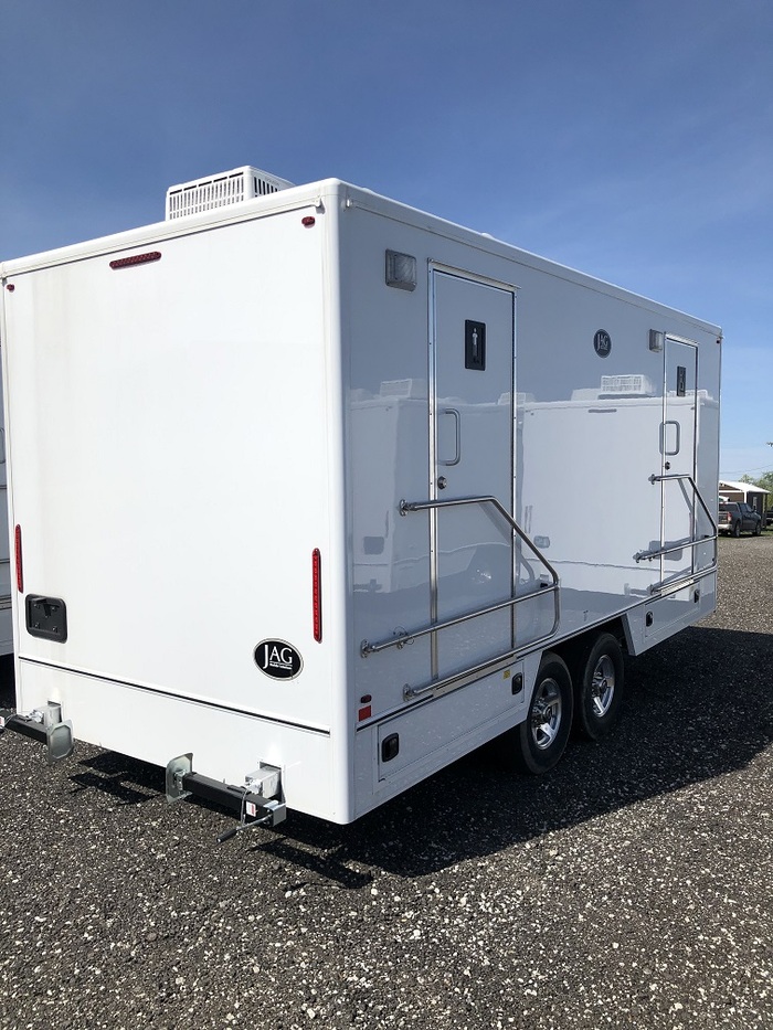 The Royal Suite deluxe bathroom trailer with 8 stalls including separate men's and women's areas,
                featuring chandeliers and premium materials