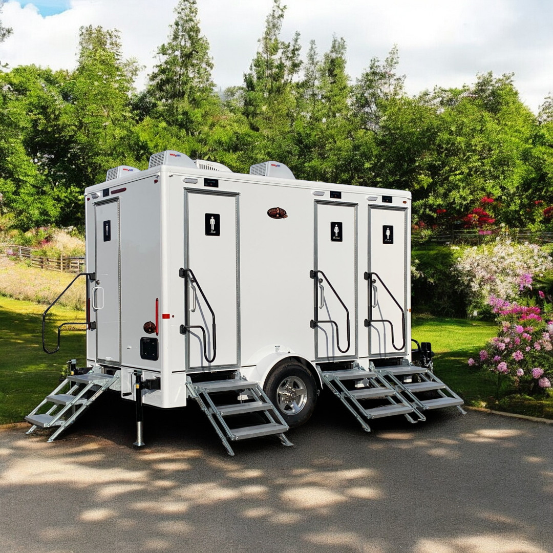 The Luxury Model bathroom trailer with 5 stalls featuring premium wood finishes, full-length mirrors,
                and upscale amenities